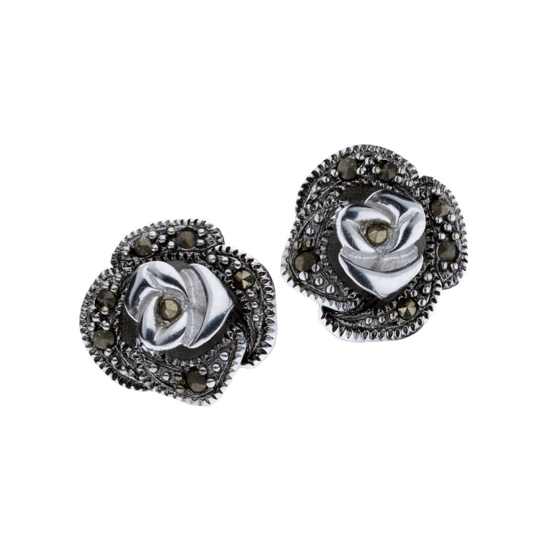 Marcasite Rose Stud Earrings: • Genuine marcasite• Rose stud design• Butterfly backings for comfortable fit• Gleaming rhodium over brass