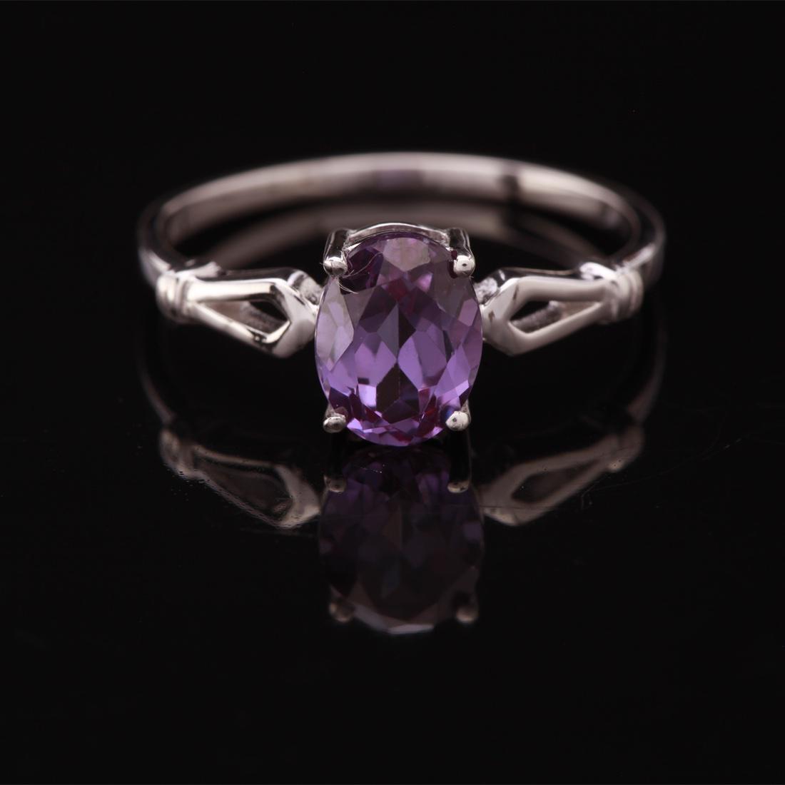 Size 7.75 Sterling Silver Syn Alexandrite Ring: Size 7.75 Sterling Silver Syn Alexandrite Ring • Metal: Sterling Silver • Stone: (1)8X6Mm-Syn Alexandrite • Width: 7.7 Mm • Total Weight: 1.76 Grs • Finish: Rhodium