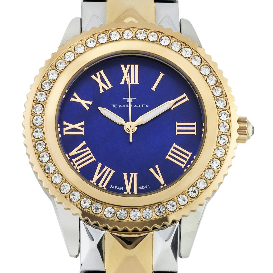 Tavan 39mm Case Luxury Mother of Pearl Dial Watch: Movement:- Japanese Quartz MovementDial:- Mother of Pearl- Silver Hue Roman Numeral Indices- Luminescent HandsCase:- 39mm Diameter- Cubic Zirconia on Coin Edge Bezel- Gold Tone- Stainless Steel Back-