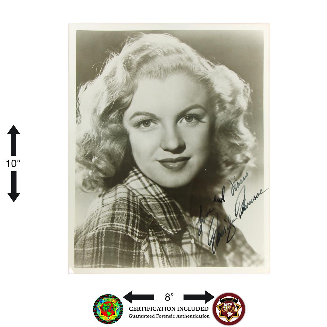 Marilyn Monroe Signed Black and White Photo: Marilyn Monroe (June 1, 1926 – August 4, 1962). Marilyn Monroe signed 8 x 10 Black and White Photograph. Signed in black ink and inscribed, ‘Love and Kisses’. A Classic Early Photogr