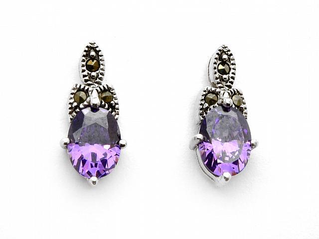 Sterling Silver Oval Amethyst & Marcasite Earrings: • Genuine marcasite •Amethyst cubic zirconia • Butterfly backings for comfortable fit • Fine Sterling Silver