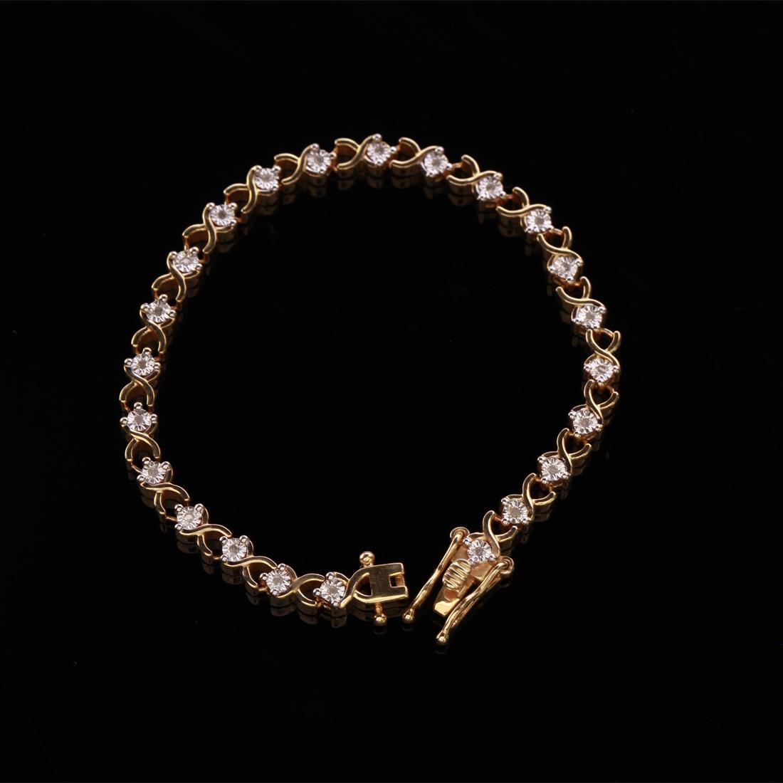 14K Over Sterling Silver Diamond Tennis Bracelet: 14K Over Sterling Silver Diamond Tennis Bracelet • Metal: Sterling Silver • Stone: Diamond • Dimensions: 4.5 Mm/7" • Total Weight: 15.16 Grs • Closure: Open Box • F