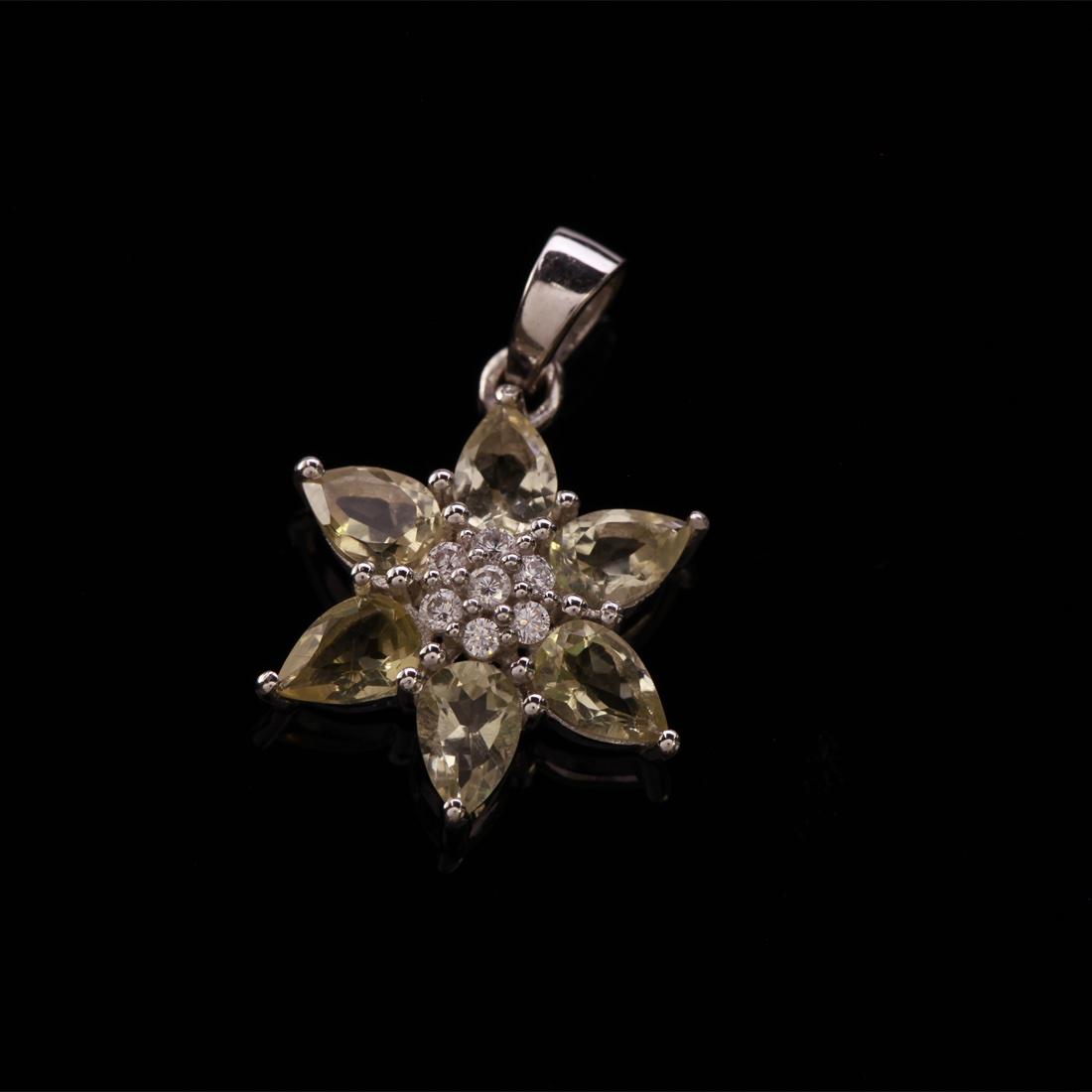 Lemon Topaz & Zircon Flower Sterling Slv Pendant: Lemon Topaz & Zircon Flower Sterling Slv Pendant • Metal: Sterling Silver • Stone: Lemon Topaz &White Zircon • Dimensions:25.98X18.16Mm • Total Weight: 2.19Grs • Finish: 