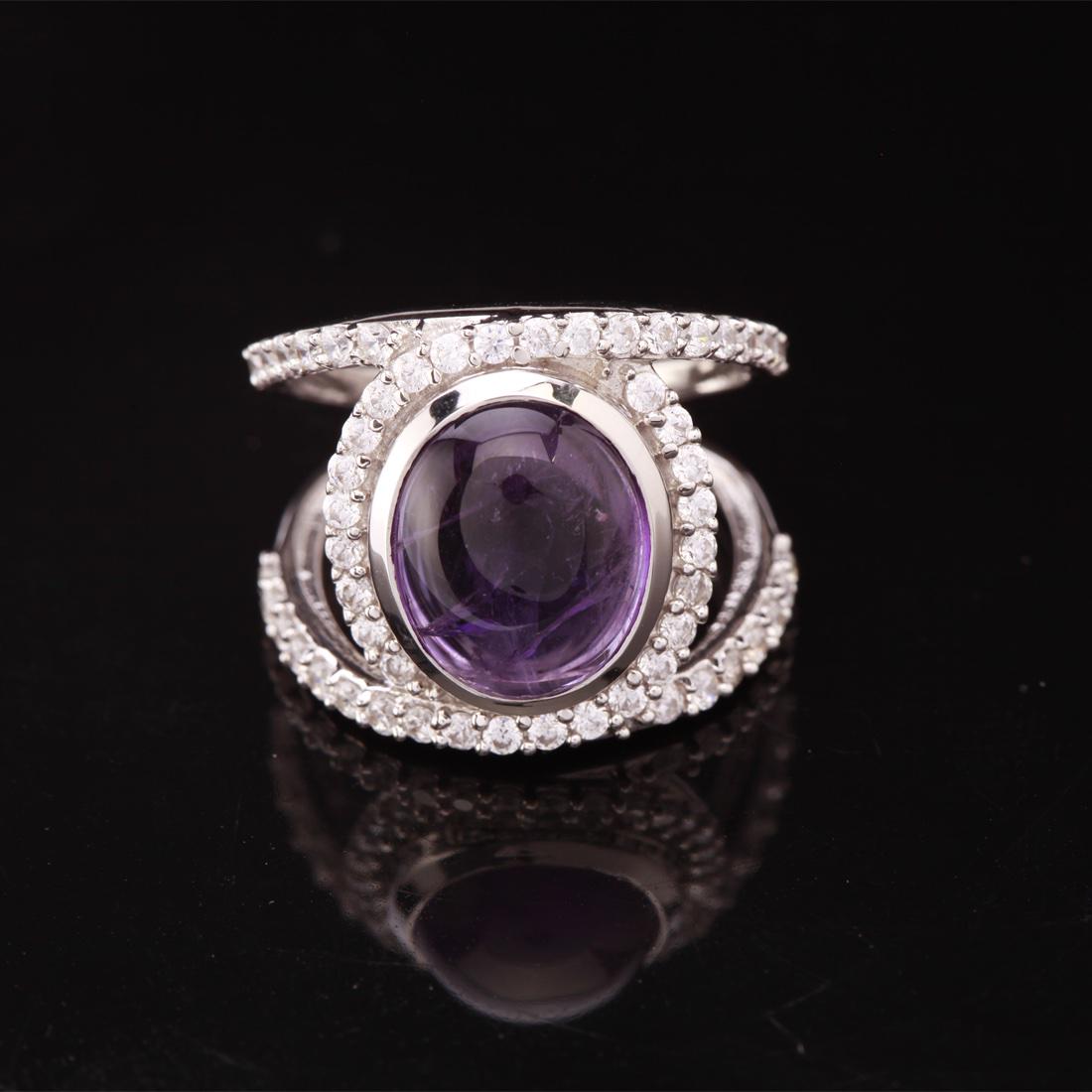 Sz 7.5 Negative Space Amethyst Sterling Slv Ring: Sz 7.5 Negative Space Amethyst Sterling Slv Ring • Metal: Sterling Silver • Stone: (1)11X9Mm-Amethyts&White Zircon • Width: 17.1 Mm • Total Weight: 6.2 Grs • Finish: Rhod