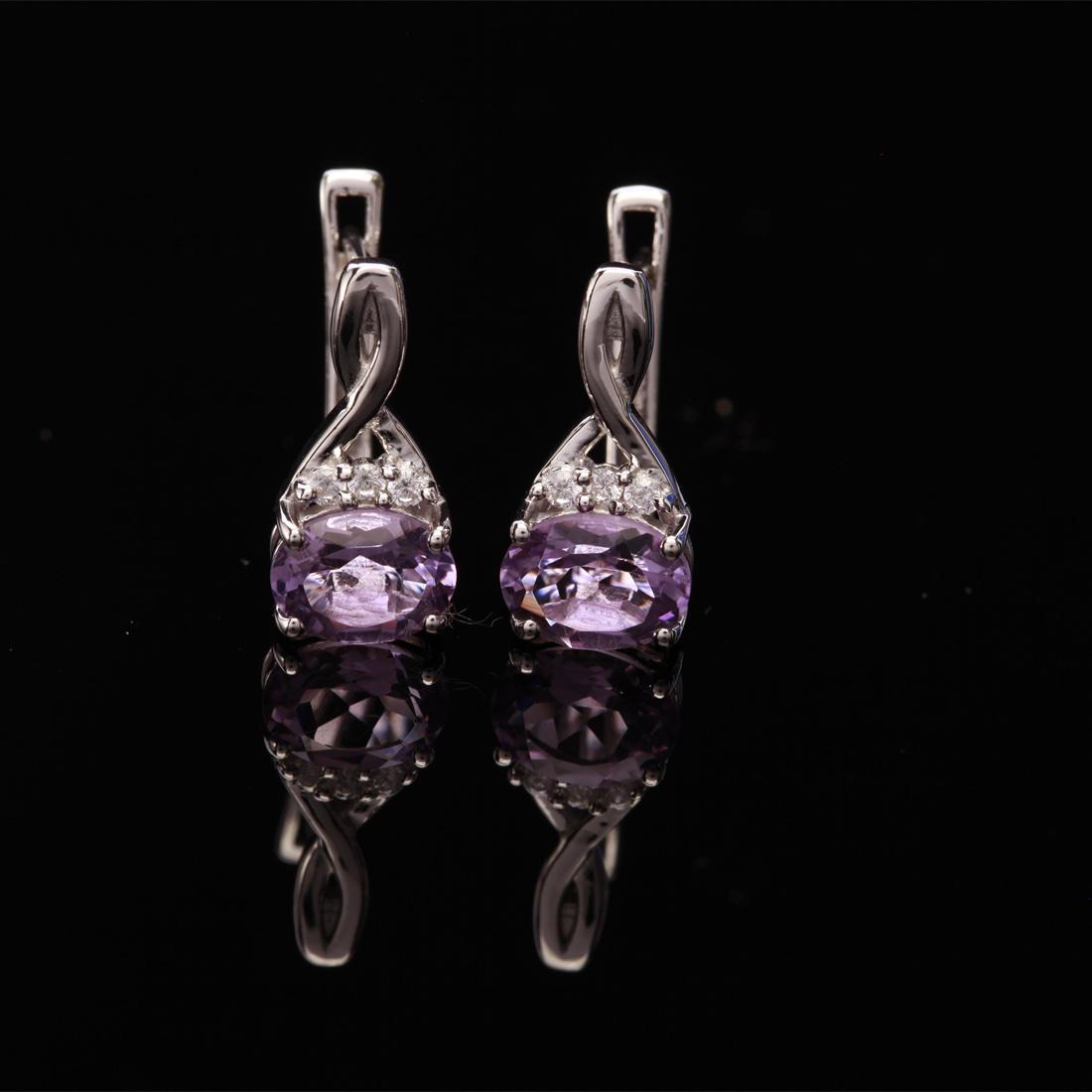 Sterling Slv Amethyst & Zircon Latch Back Earrings: Sterling Slv Amethyst & Zircon Latch Back Earrings • Metal: Sterling Silver • Stone: (2)8X6Mm-Pink Amethyts &White Zircon • Dimensions: 16.13X7.97 Mm • Total Weight: 4.02Grs &#