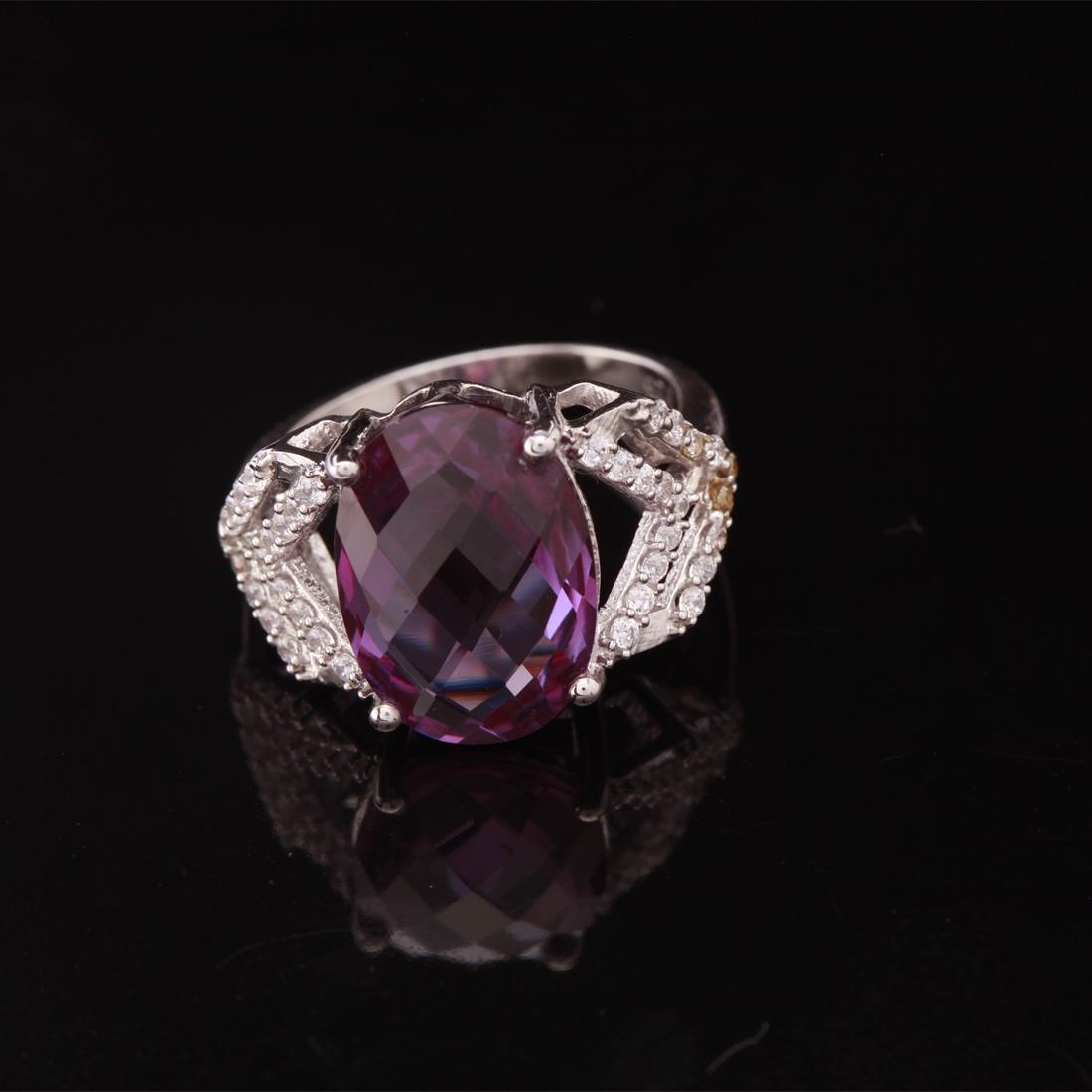 Sz 7.5 Sterling Slv Syn Alexandrite & Zircon Ring: Sz 7.5 Sterling Slv Syn Alexandrite & Zircon Ring • Metal: Sterling Silver • Stone: (1)14X10Mm-Syn Alexandrite & White Zircon • Width: 13.9 Mm • Total Weight: 4.2 Grs • F
