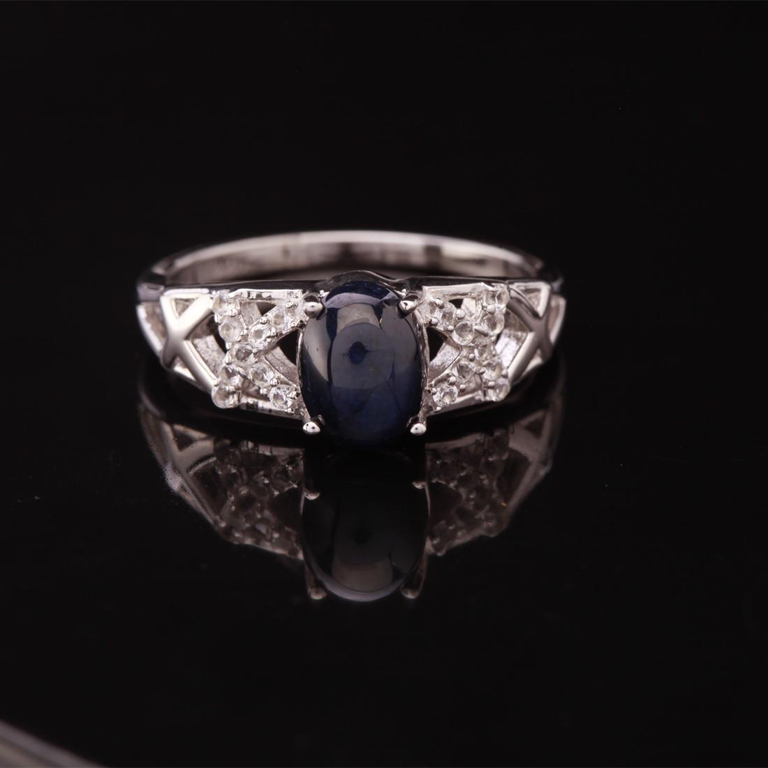 Size 8 Star Sapphire & Zircon Sterling Slv Ring: Size 8 Star Sapphire & Zircon Sterling Slv Ring • Metal: Sterling Silver • Stone: (1)8X6Mm-Star Sapphire &White Zircon • Width: 7.7 Mm • Total Weight: 3.03 Grs • Finish: 