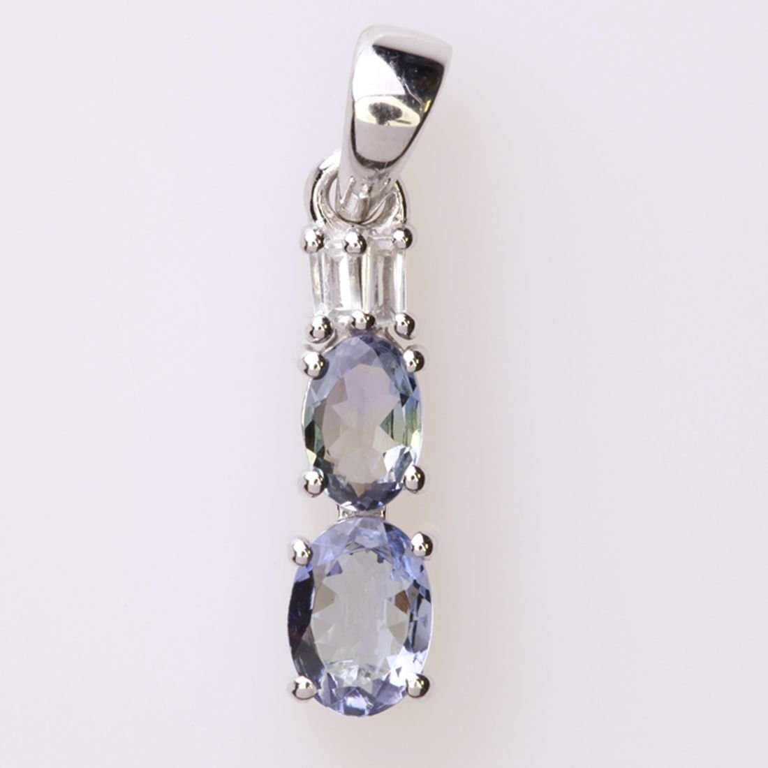 Sterling Silver Bio Tanzanite & Zircon Pendant: Sterling Silver Bio Tanzanite & Zircon Pendant • Metal: Sterling Silver • Stone: Bio Tanzanite&White Zircon • Dimensions: 5.1X24.8 Mm • Total Weight: 1.62 Grs • Finish: Rhodiu