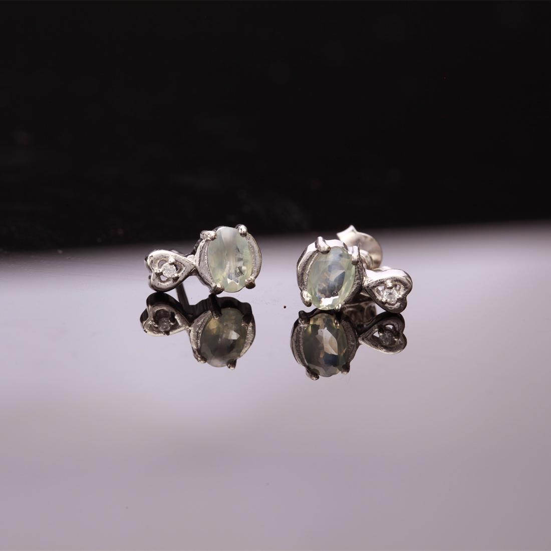 Sterling Silver Alexandrite & Zircon Stud Earrings: Sterling Silver Alexandrite & Zircon Stud Earrings • Metal: Sterling Silver • Stone: (2)6X4Mm-Natural Alexandrite &White Zircon • Dimensions:10.49X6.05 Mm • T:Otal Weight: 1.77