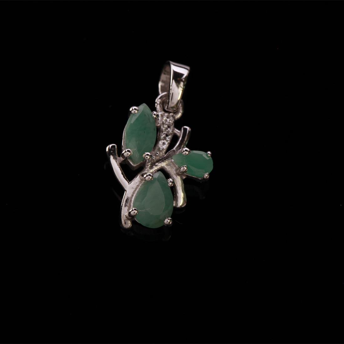 Green Emerald & Zircon Sterling Silver Pendant: Green Emerald & Zircon Sterling Silver Pendant • Metal: Sterling Silver • Stone: Emerald &White Zircon • Dimensions: 22.4X13 Mm • Total Weight: 1.81 Grs • Finish: Rhodium