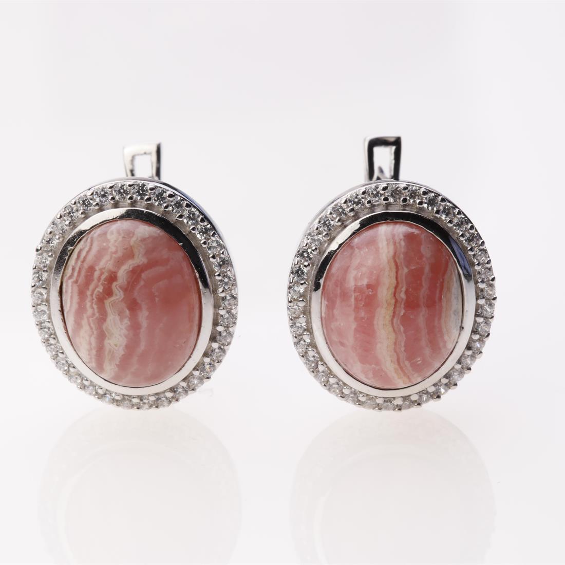 Rhodochrosite & Zircon Sterling Slv Halo Earrings: Rhodochrosite & Zircon Sterling Slv Halo Earrings .Metal: Sterling Silver .Stone: 12X10 Mm Ov Rhdochrosite&White Zircon .Dimension: 16.7X14.8 Mm .Total Weight: 8.38 Grams .Finish: Rhodium .Backing: Fr