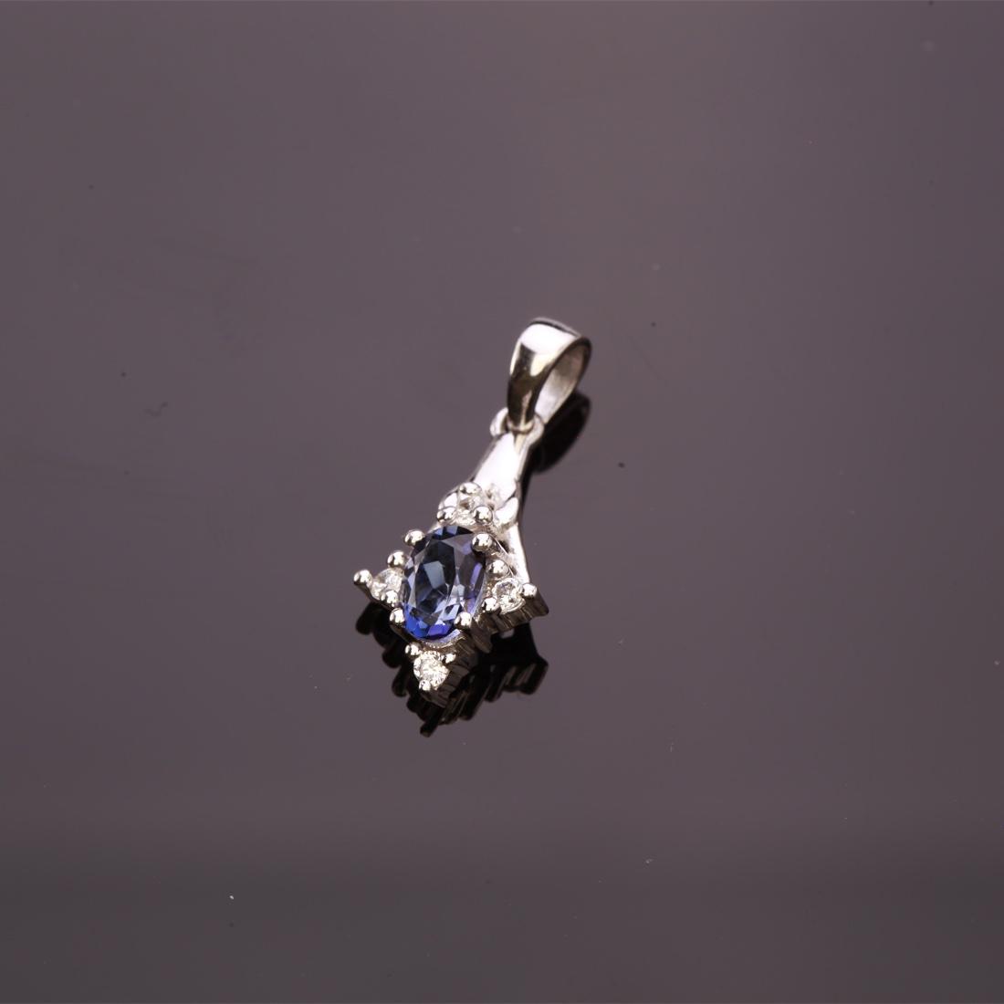 Radiant Iolite & Zircon Sterling Silver Pendant: Radiant Iolite & Zircon Sterling Silver Pendant • Metal: Sterling Silver • Stone: (1)7X5Mm-Iolite&White Zircon • Dimensions: 25.83X11.06 Mm • Total Weight: 1.49Grs • Fini
