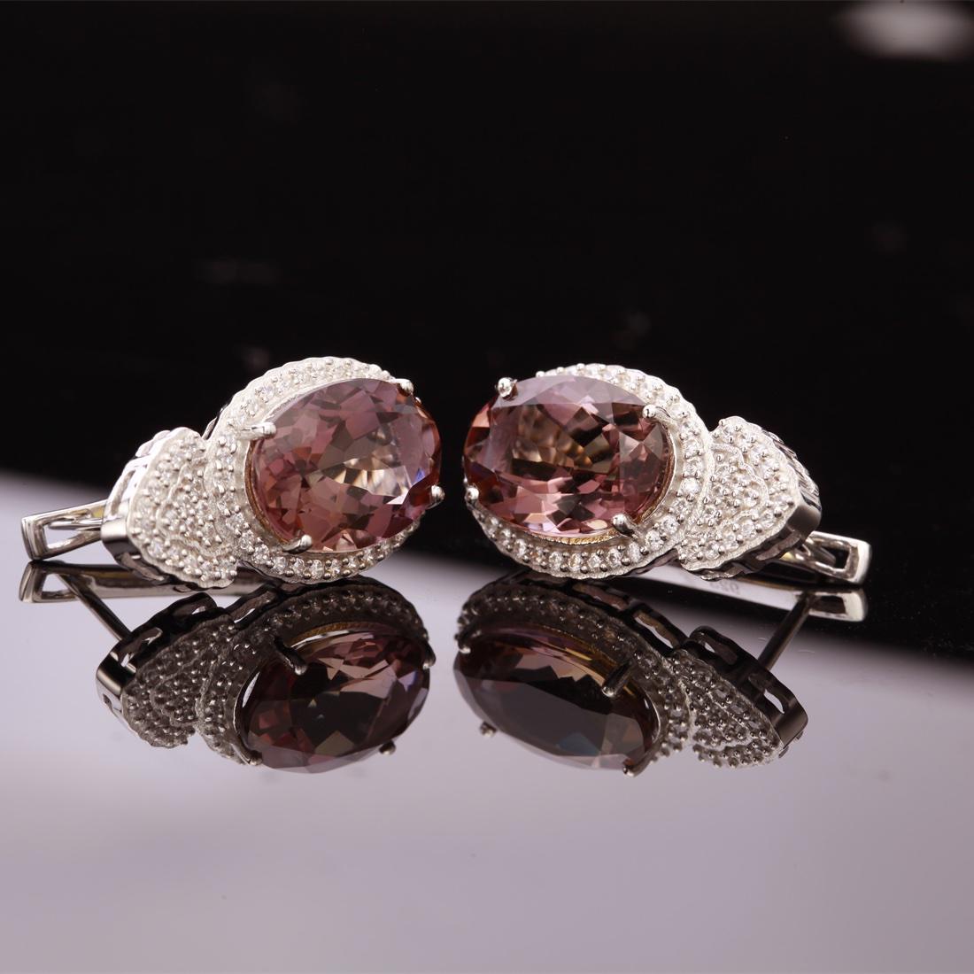 Sterling Silver Nano Ametrine Latchback Earrings: Sterling Silver Nano Ametrine Latchback Earrings • Metal: Sterling Silver • Stone: (2)14X10Mm-Nano Ametrine &White Zircon • Dimensions: 24.29X13.67 Mm • Total Weight: 9.4 Grs &