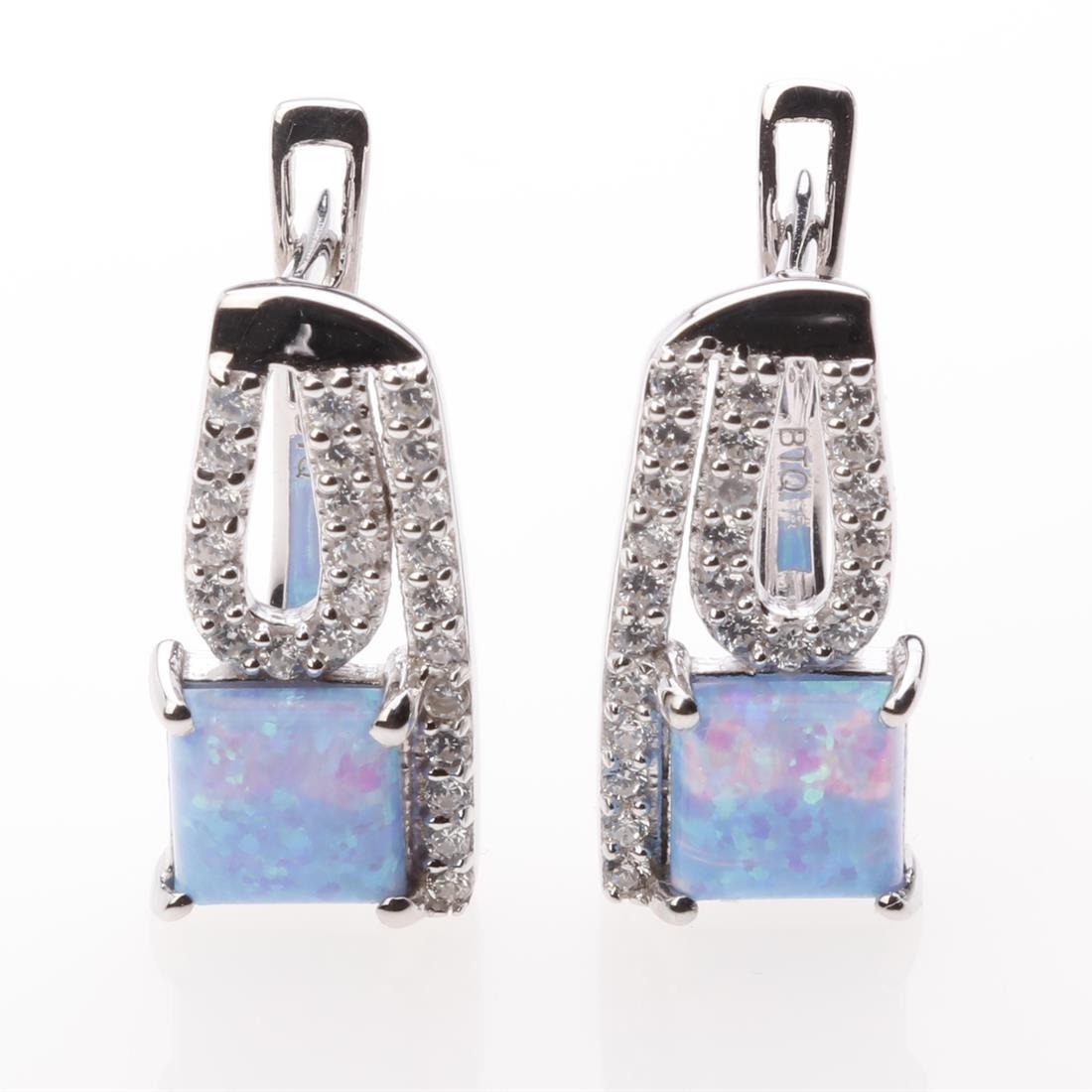 Sterling Silver Syn Azure Opal & Zircon Earrings: Sterling Silver Syn Azure Opal & Zircon Earrings • Metal: Sterling Silver • Stone: 6 Mm Syn Azure Opal&White Zircon • Dimension: 17.2X8.5 Mm • Total Weight: 3.83 Grams •