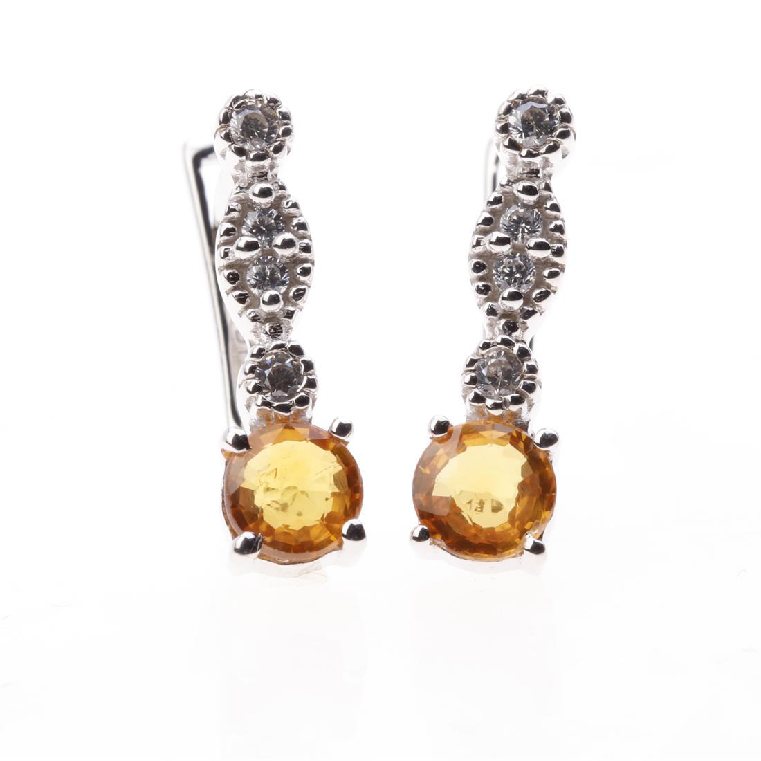 Orange Sapphire & Zircon Sterling Silver Earrings: Orange Sapphire & Zircon Sterling Silver Earrings • Metal: Sterling Silver • Stone: 5 Mm Rd Orange Sapphire&White Zircon • Dimension: 17.36X5 Mm • Total Weight: 3.25 Grams R