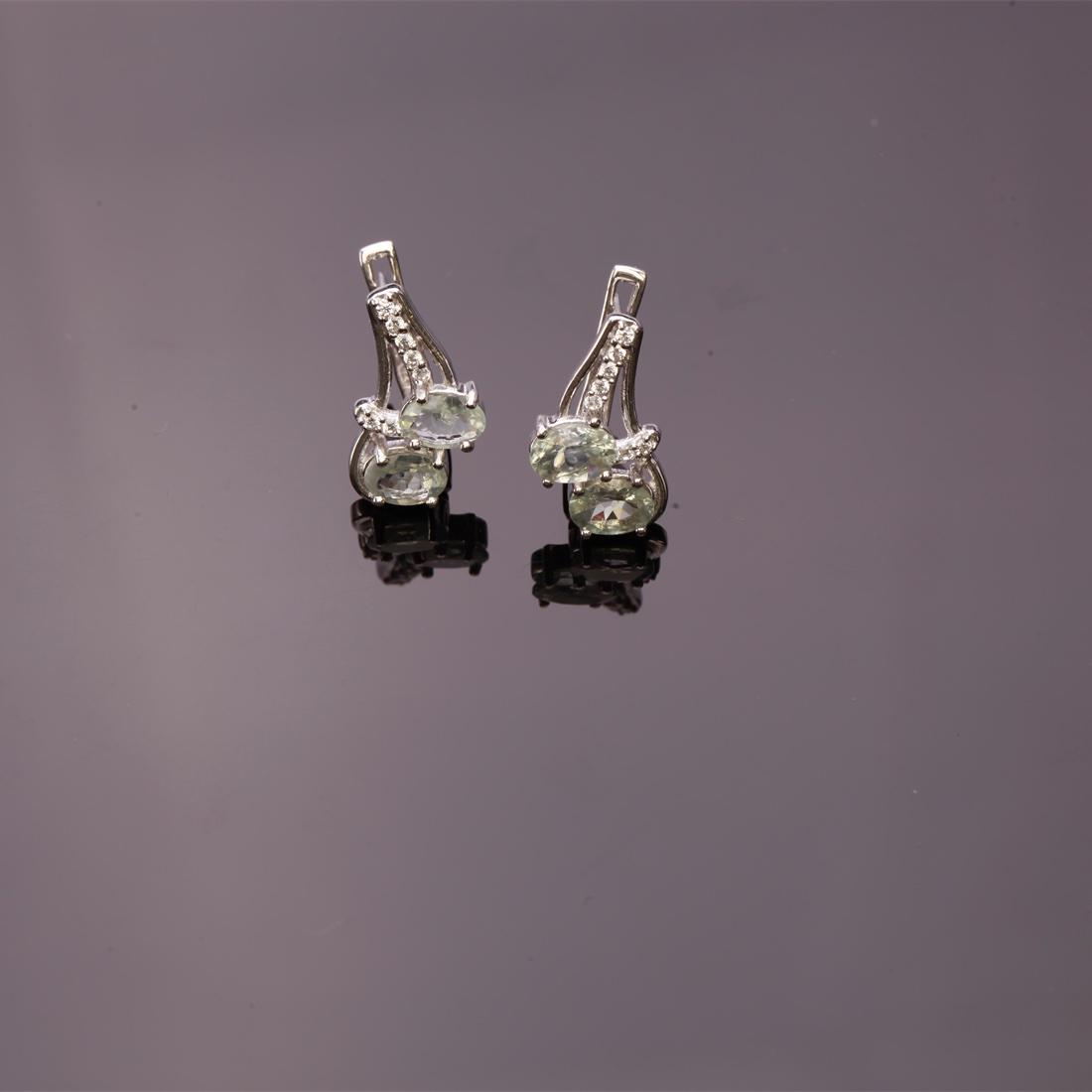 Sterling Silver Alexandrite & Zircon Earrings: Sterling Silver Alexandrite & Zircon Earrings • Metal: Sterling Silver • Stone: (4)6X4Mm-Natural Alexandrite &White Zircon • Dimensions: 15.75X10.21Mm • Total Weight: 3.92 Grs 
