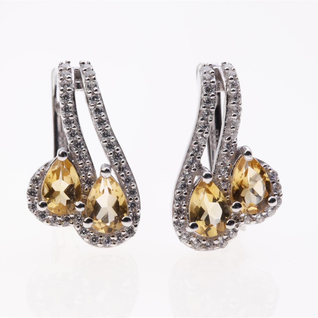 Citrine & Zircon Sterling Silver Earrings: Citrine & Zircon Sterling Silver Earrings .Metal: Sterling Silver .Stone: 6X4 Mm Pr Citrine&White Zircon .Dimension: 19.1X11.2Mm .Total Weight: 4.7 Grams .Finish: Rhodium .Backing: French Clip