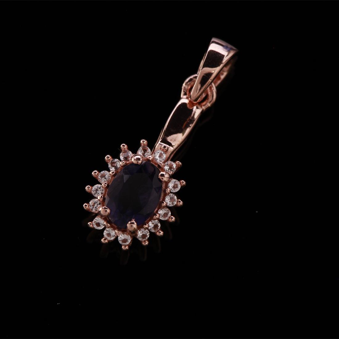 Rose Gold Over Silver Iolite & White Topaz Pendant: Rose Gold Over Silver Iolite&White Topaz Pendant • Metal: Sterling Silver • Stone: (1)7X5Mm-Iolite&White Topaz • Dimensions: 9.3X25.1 Mm • Total Weight: 1.5 Grs • Finish: