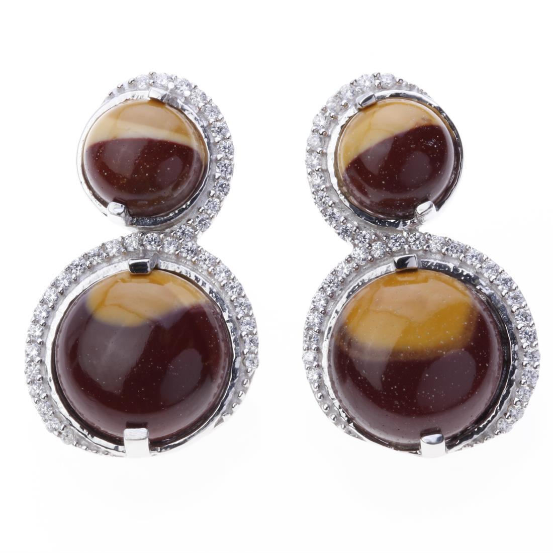 Mookaite Zircon Circles Sterling Silver Earrings: Mookaite Zircon Circles Sterling Silver Earrings .Metal: Sterling Silver .Stone: 8,12Mm Rd Mookite&White Zircon .Dimension: 27.1X16.2 Mm .Total Weight: 9.95 Grams .Finish: Rhodium .Backing: French Cli