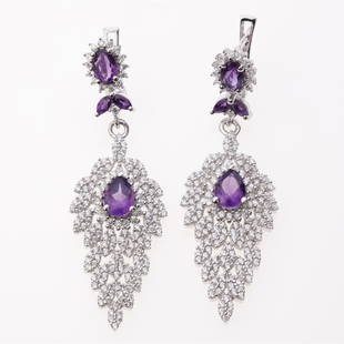 African Amethyst & Zircon Dangle Silver Earrings: African Amethyst & Zircon Dangle Silver Earrings .Metal: Sterling Silver .Stone: 7X5 Mm Pr African Amethyst & White Zircon .Dimension: 51.6X16.6Mm .Total Weight: 10.58 Grams .Finish: Rhodium .Backing: