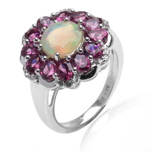 Silver Ethiopian Opal & Garnet Flower Ring-SZ 7: Infused with Spring! One round mesmerizing Ethiopian opal surrounded by pear shaped purple garnet creates an enchanting flower shape on the top of this sterling silver ring. White topaz accents