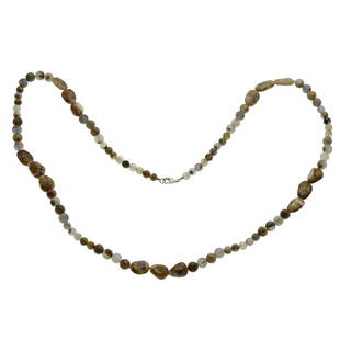 Sterling Silver Chalcedony Beaded Necklace 40": • Metal: Rhodium over sterling silver • Stone Information: Various round full-drilled 8-10mm and various freeform shaped full-drilled 18 x 8mm multi color chalcedony beads • Setting