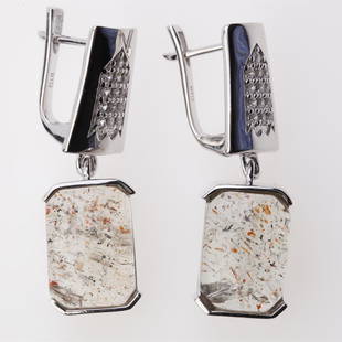 Green Sunstone & Zircon Dangle Silver Earrings: Green Sunstone & Zircon Dangle Silver Earrings .Metal: Sterling Silver .Stone: 14X10 Mm Octagon Green Sunstone&White Zircon .Dimension: 35.5X11.1 Mm .Total Weight: 11.74 Grams .Finish: Rhodium