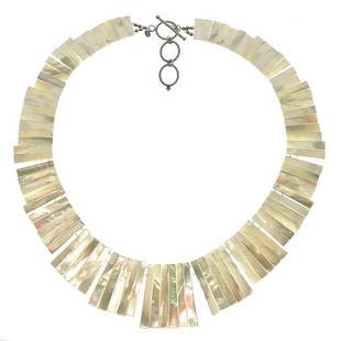 Sterling Silver White MOP Toggle Bib Necklace 19": • Genuine white mother of pearl shell • 19 inch adjustable length • Toggle clasp • Gleaming rhodium over fine sterling silver