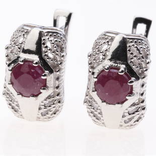 Sterling Silver Indian Ruby Latchback Earrings: Sterling Silver Indian Ruby Latchback Earrings .Metal: Sterling Silver .Stone: 5 Mm Rd Indian Ruby .Dimension: 13.9X9.2Mm .Total Weight: 5.1 Grams .Finish: Rhodium .Backing: Latchback