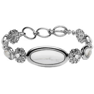 Silver White Calcite Quartz Toggle Bracelet 7.75": One large oval White Buffalo Calcit Quartz cabochon anchors the piece at the center. Round White Buffalo Calcite Quartz cabochons in floral motif stations and oval stations alternate out from that