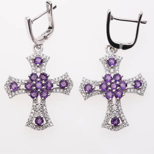 African Amethyst & Zircon Cross Dangle Earrings: African Amethyst & Zircon Cross Dangle Earrings .Metal: Sterling Silver .Stone: 3 Mm Rd African Amethyst & White Zircon .Dimension: 44.3X23.3Mm .Total Weight: 9.96 Grams .Finish: Rhodium .Backing:
