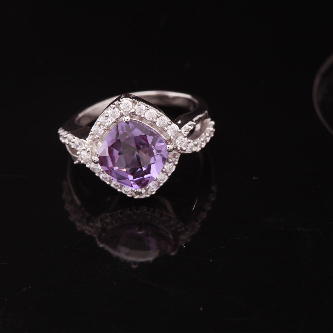 Size 5.25 Sterling Syn Alexandrite & Zircon Ring: Size 5.25 Sterling Syn Alexandrite & Zircon Ring • Metal: Sterling Silver • Stone: (1)13X13 Mm Syn Alexandrite & White Zircon • Width: 13.6 Mm • Total Weight: 3.95 Grs • 