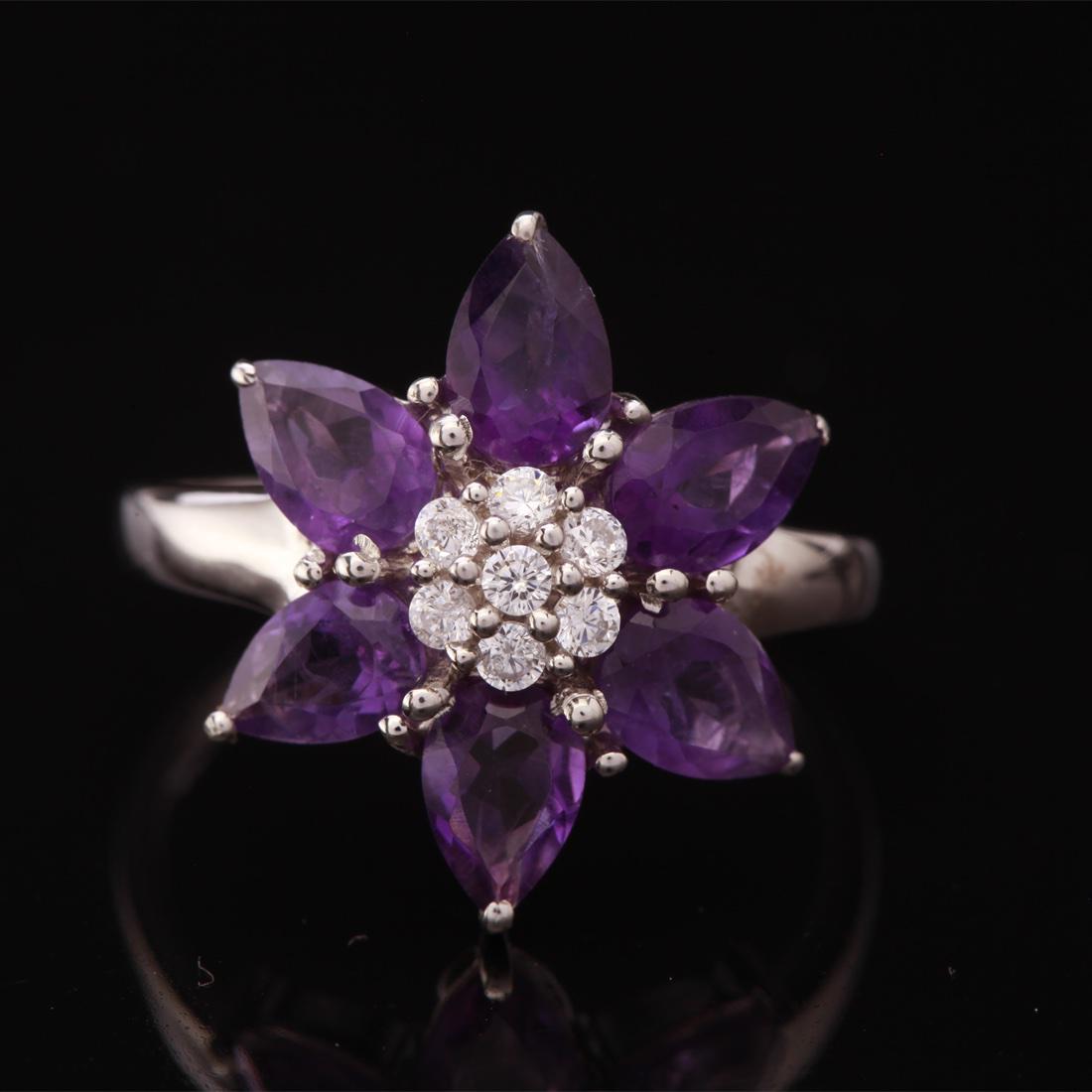 Size 6.5 Sterling Silver African Amethyst Ring: Size 6.5 Sterling Silver African Amethyst Ring • Metal: Sterling Silver • Stone: African Amethyst & White Zircon • Width: 17.3 Mm • Total Weight: 3.45Grs • Finish: Rhodiu