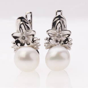 Pearl & Zircon Flower Sterling Silver Earrings: Pearl & Zircon Flower Sterling Silver Earrings .Metal: Sterling Silver .Stone: White Pearl&White Zircon .Dimension: 19X10 Mm .Total Weight: 7.15 Grams .Finish: Rhodium .Backing: French Clip