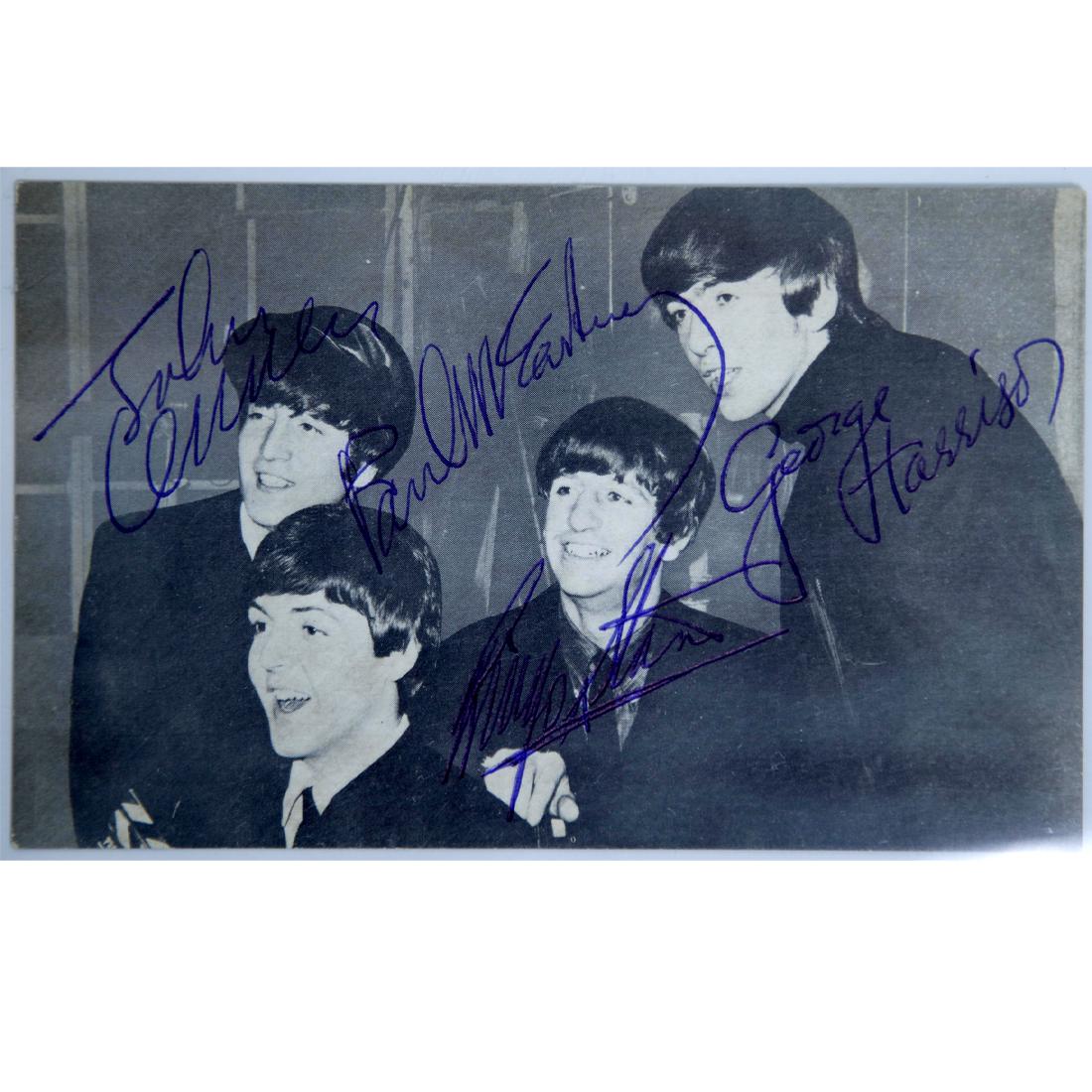 The Beatles Signed Black &White Postcard 5.25x3.25: The Beatles (1960-1970) signed 3.25x 5.25 Black and White 1964 Postcard of the Fab Four at the beginning of their fame. John Lennon, Paul McCartney, George Harrison and Ringo Starr all signed in blue