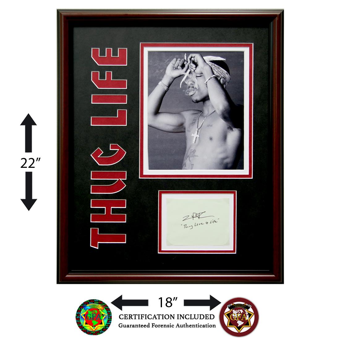 Tupac Shakur Signed Cut Paper: Tupac Shakur (June 16, 1971 – September 13, 1996). 2Pac signed 3.75 X 7.5 cut paper. Signed Boldy in black ink and inscribed, ‘Thug Love 4 Life’. Tupac Shakur was an American rapper