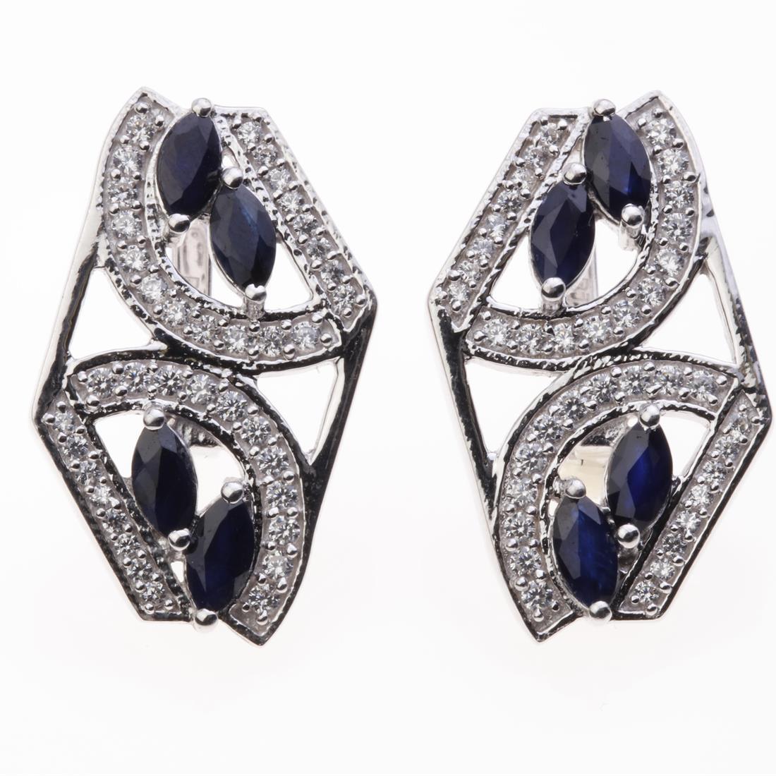 Marquise Sapphire & Zircon Silver Earrings: Marquise Sapphire & Zircon Silver Earrings .Metal: Sterling Silver .Stone: 6X3 Mm Mq Blue Sapphire&Zircon .Dimension: 27.15X16.7Mm .Total Weight: 9.88 Grams .Finish: Rhodium .Backing: French Clip