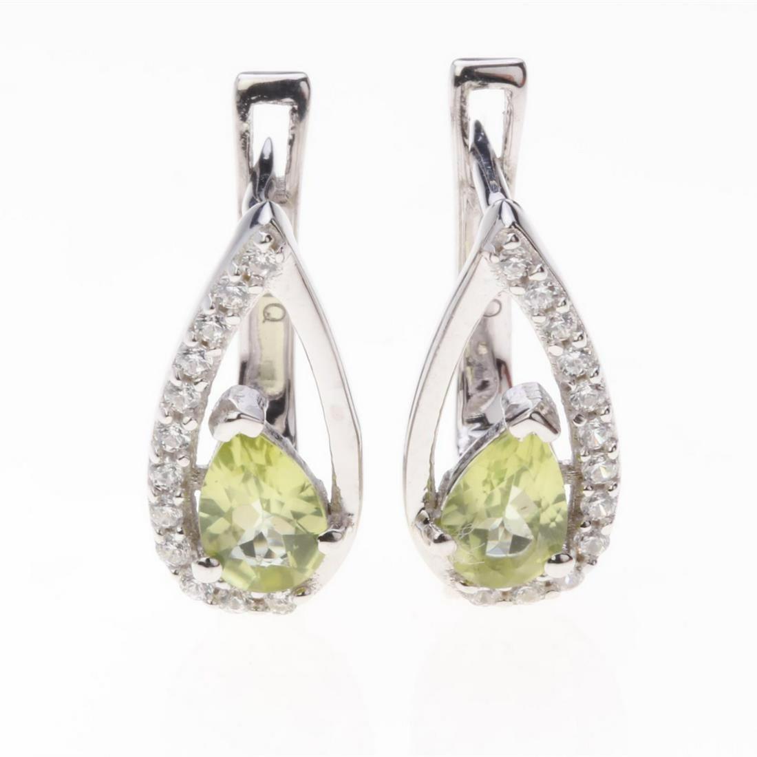 Sterling Silver Peridot & Zircon Earrings: Sterling Silver Peridot & Zircon Earrings .Metal: Sterling Silver .Stone: 6X4 Mm Pr Peridot&White Zircon .Dimension: 14.26X7.26 Mm .Total Weight: 3.05 Grams .Finish: Rhodium .Backing: French Clip