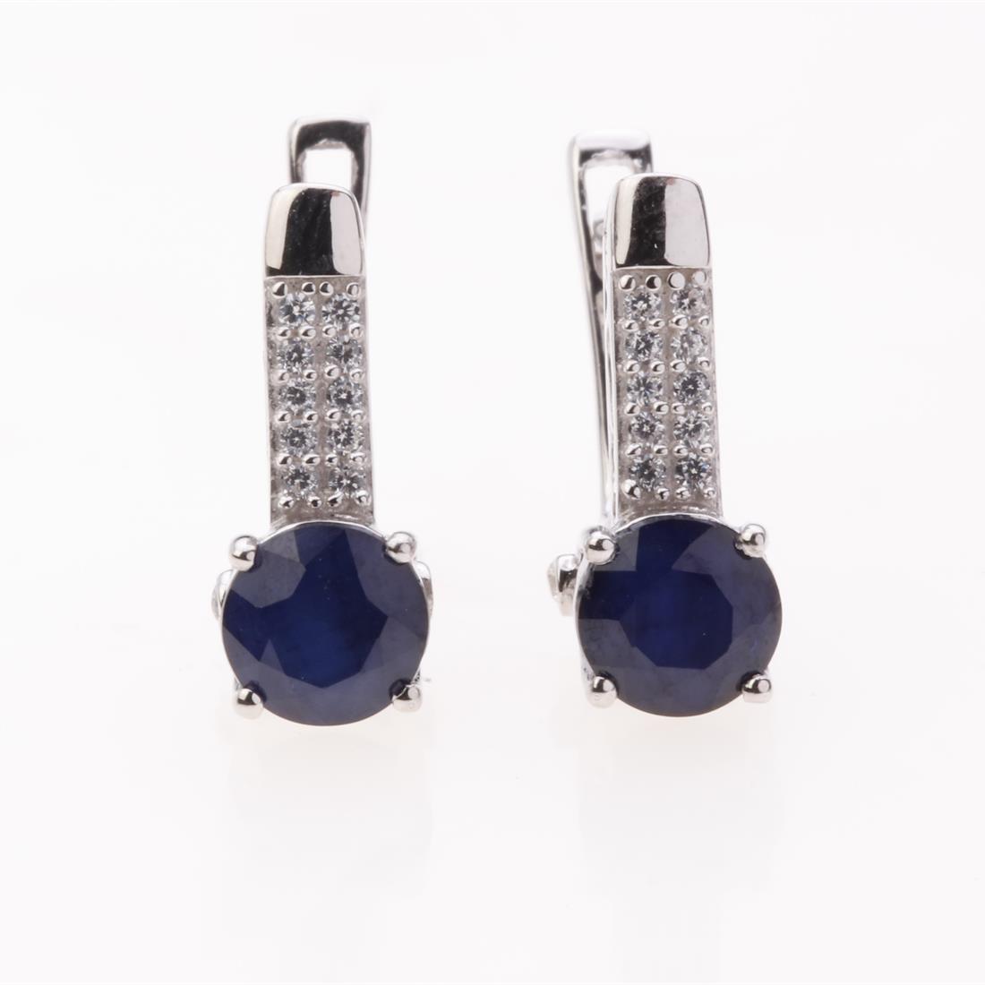 Sapphire & White Zircon Latchback Silver Earrings: Sapphire & White Zircon Latchback Silver Earrings .Metal: Sterling Silver .Stone: 6Mm Rd Blue Sapphire&White Zircon .Dimension: 15.92X6.75 Mm .Total Weight: 3.52 Grams .Finish: Rhodium .Backing: Latch