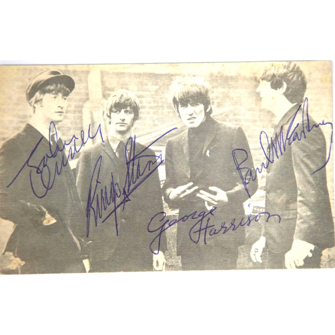 The Beatles Signed Black/White Postcard: The Beatles (1960-1970) signed Black and White Photo Postcard. John Lennon, Paul McCartney, George Harrison and Ringo Starr signed in blue ink; all four signatures are boldly signed. The autographed p
