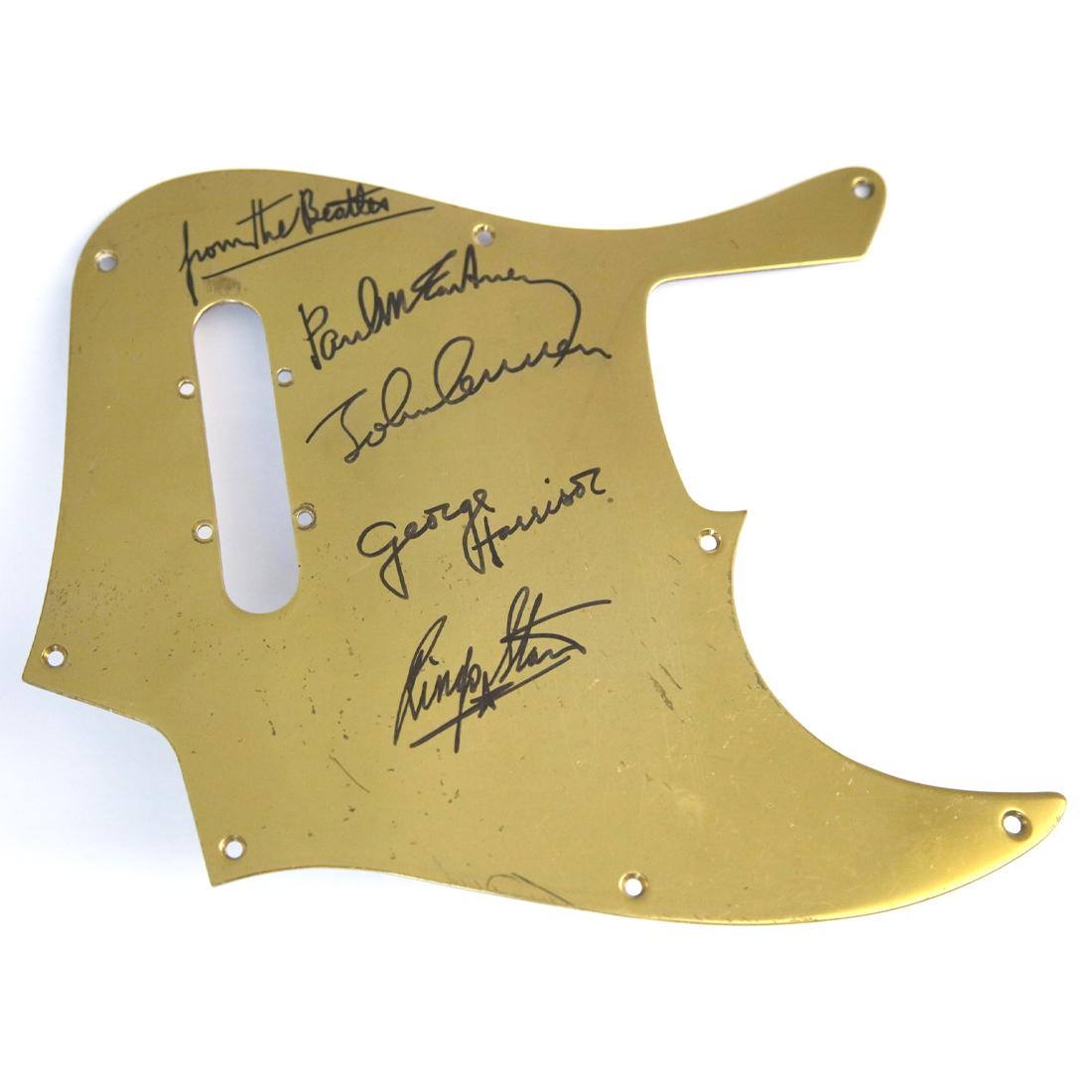 Beatles Signed And Inscribed Guitar Pick Guard: The Beatles (1960-1970) signed pick guard. John Lennon, Paul McCartney, George Harrison and Ringo Starr signed in black ink, all four signatures are boldly signed and have the inscription, ‘From