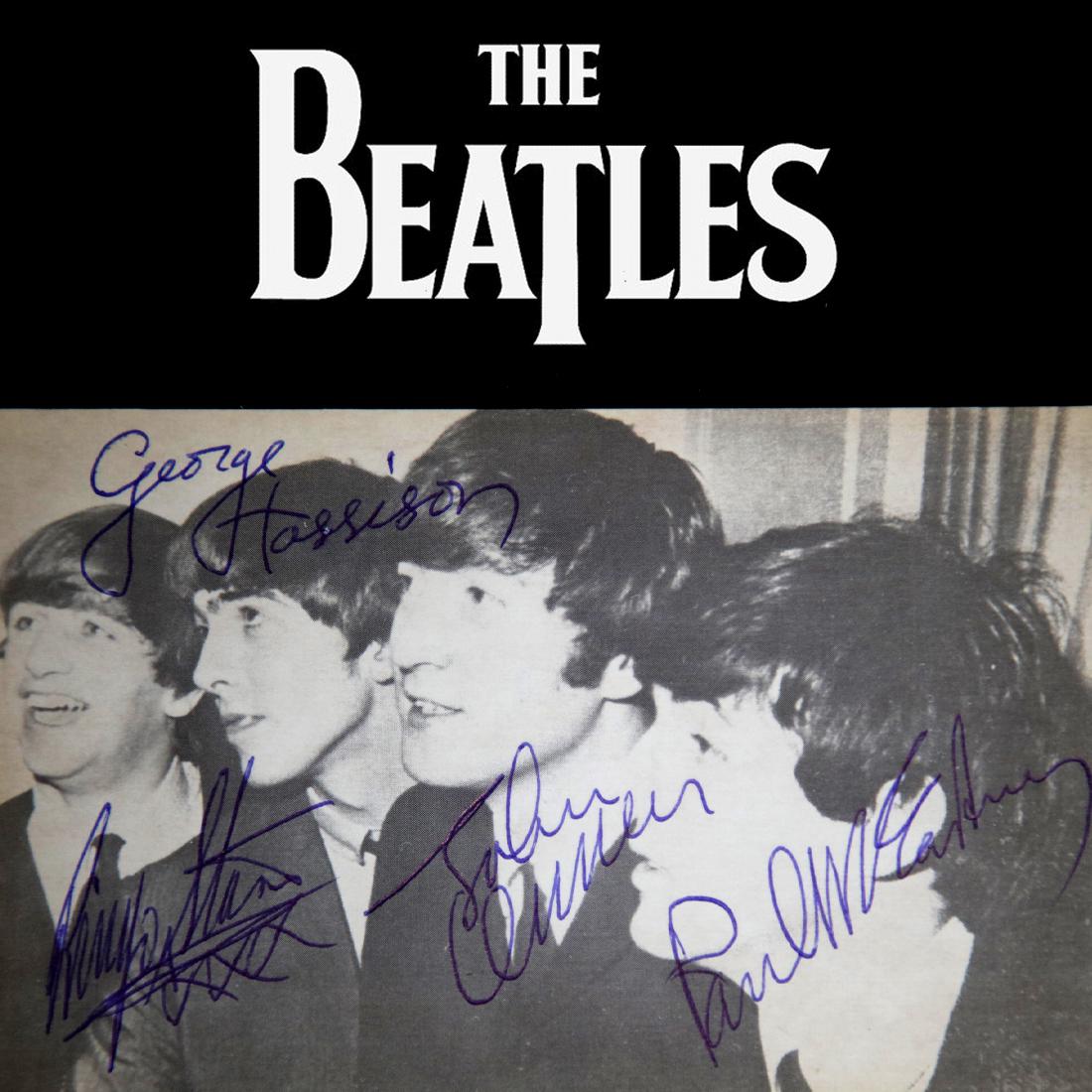 The Beatles Signed Black/White Postcard: The Beatles (1960-1970) signed Black and White Photo Postcard. John Lennon, Paul McCartney, George Harrison and Ringo Starr signed in blue ink; all four signatures are boldly signed. The autographed p