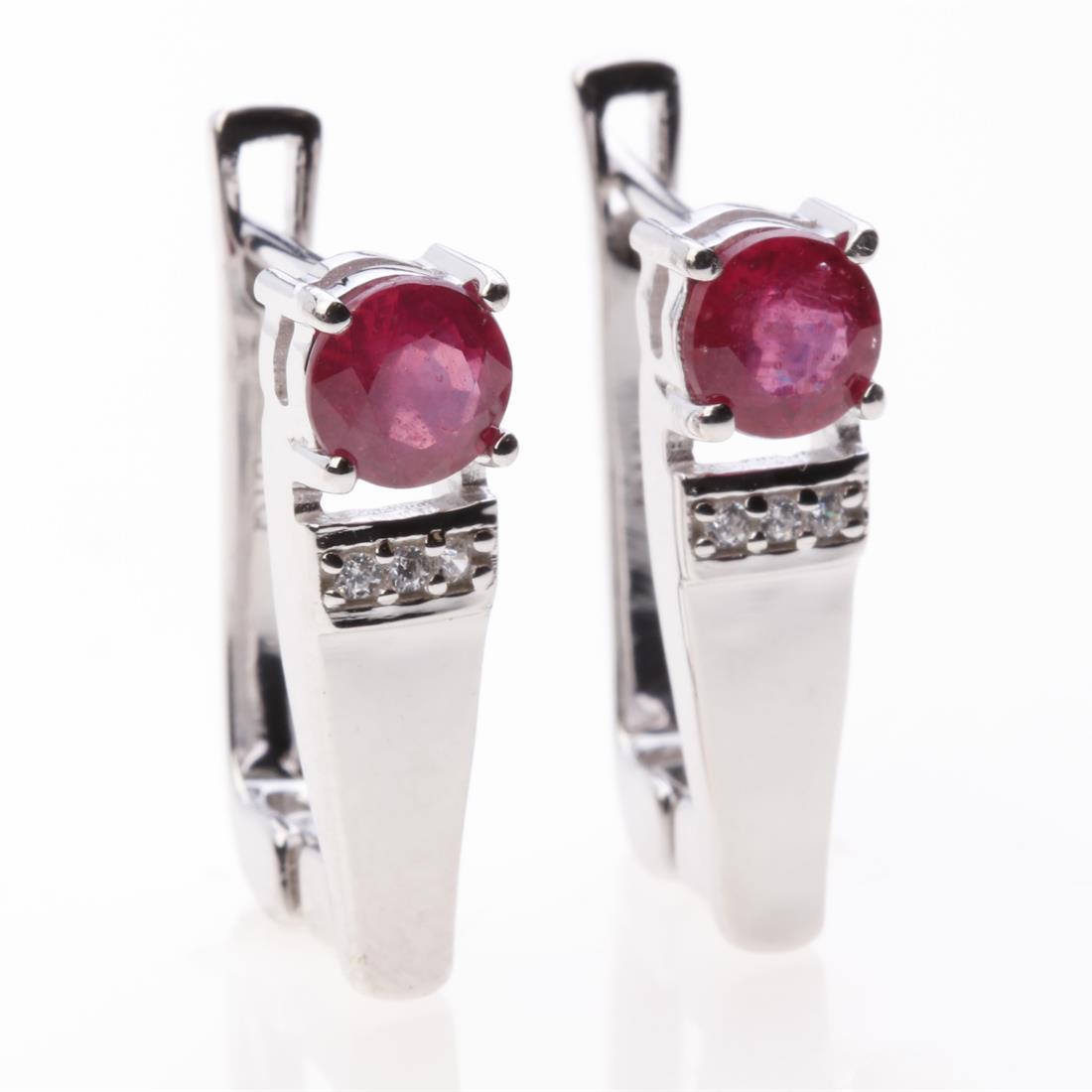 Sterling Slv Ruby Glass Filled & Zircon Earrings: Sterling Slv Ruby Glass Filled & Zircon Earrings • Metal: Sterling Silver • Stone: Ruby Glass Filled&White Zircon • Dimension: 18.3X5.3 Mm • Total Weight: 3.78 Grams • Fi