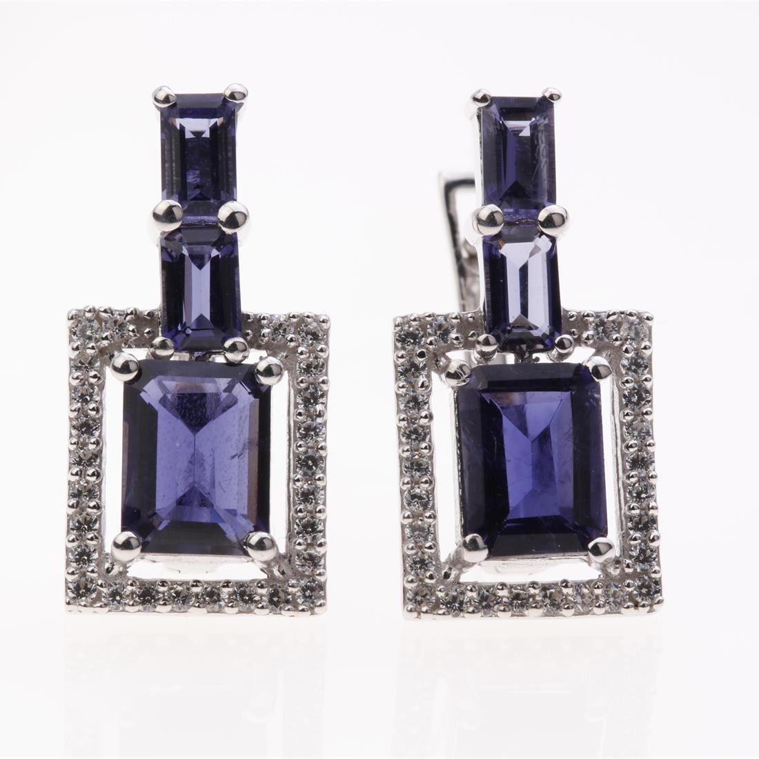 Contemporary Iolite & Zircon Silver Earrings: Contemporary Iolite & Zircon Silver Earrings .Metal: Sterling Silver .Stone: Iolite & White Zircon .Dimension: 22.1X11 Mm .Total Weight: 5.27 Grams .Finish: Rhodium .Backing: French Clip