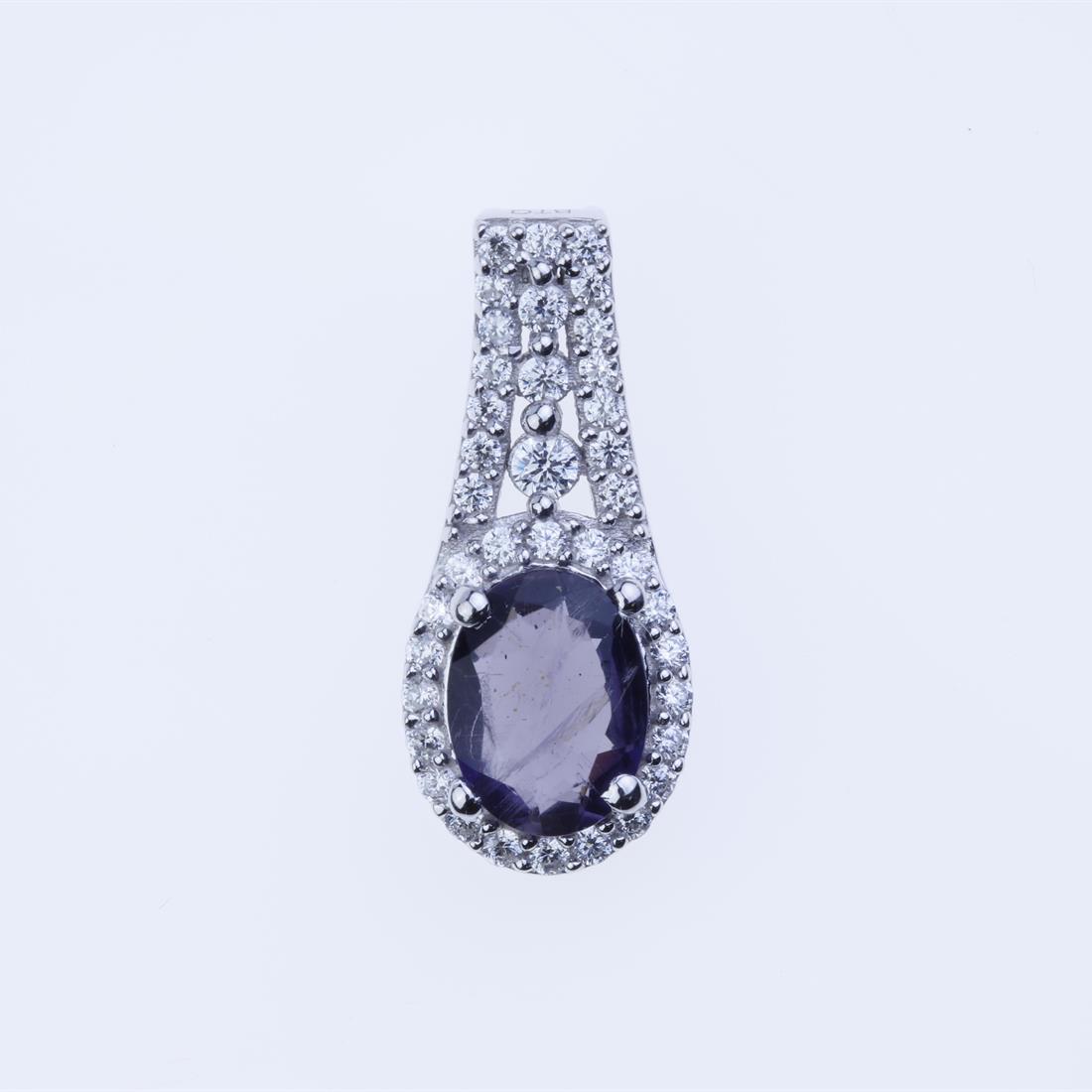 Iolite & White Zircon Sterling Silver Pendant: Iolite & White Zircon Sterling Silver Pendant • Metal: Sterling Silver • Stone: 8X6 Mm Oval Shape Iolite&White Zircon • Dimension: 20.3X9 Mm • Total Weight: 1.85 Grams •