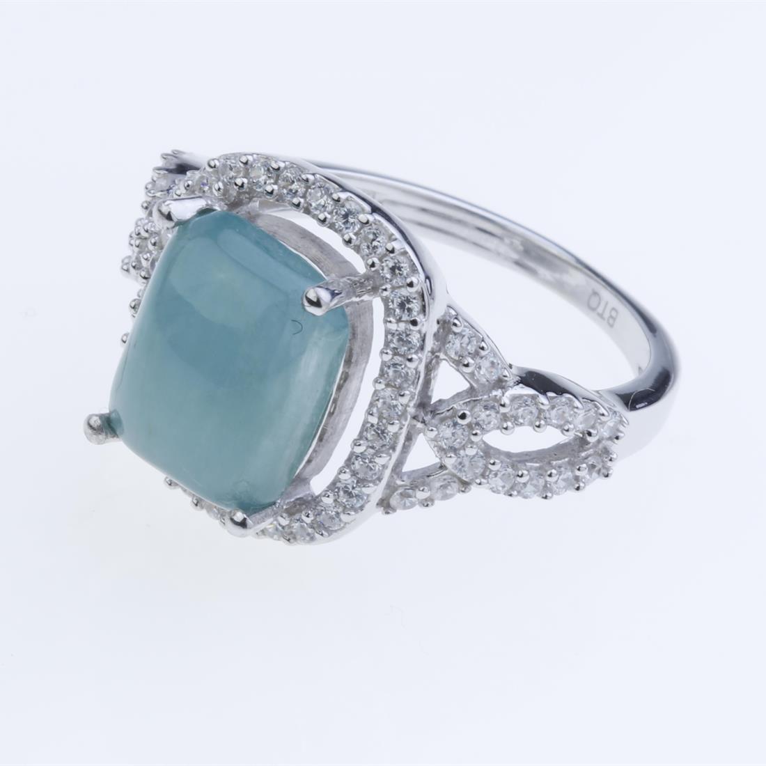 Size 7 Sterling Slv Grandidierite & Zircon Ring: Size 7 Sterling Slv Grandidierite & Zircon Ring • Metal: Sterling Silver • Stone: 10X8Mm Grandidierite, White Zircon • Width : 14.3 Mm • Total Weight(Approx): 4.1 Grams •