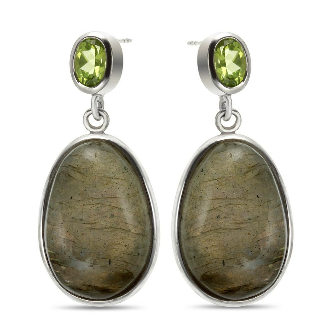 Sterling Silver Labradorite & Peridot Drop Earring: Crafted in rhodium over sterling silver, each earring in this charming pair features one large oval labradorite cabochon at the center of the dangle. One oval cut faceted peridot decorates the post an