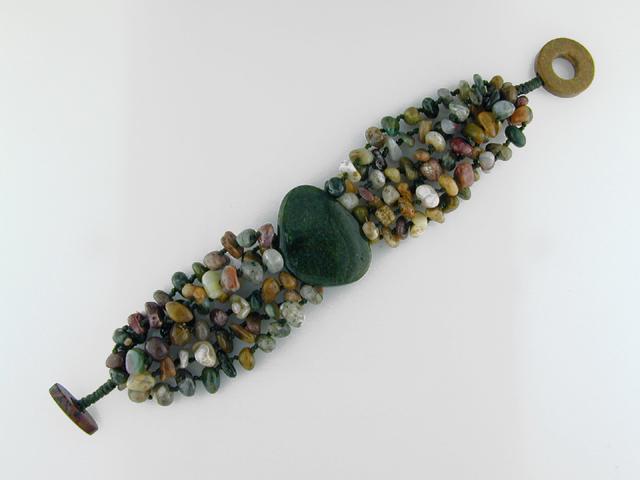 Multi Strand Ocean Jasper Bracelet 7.5 Intch: Multi Strand Ocean Jasper Bracelet 7.5 Intch • Stone:Ocean Jasper • Width: 35Mm • Length: 7.5 Intch • Total Weight: 60.1 Grams • Closuret: Jasper Toggle