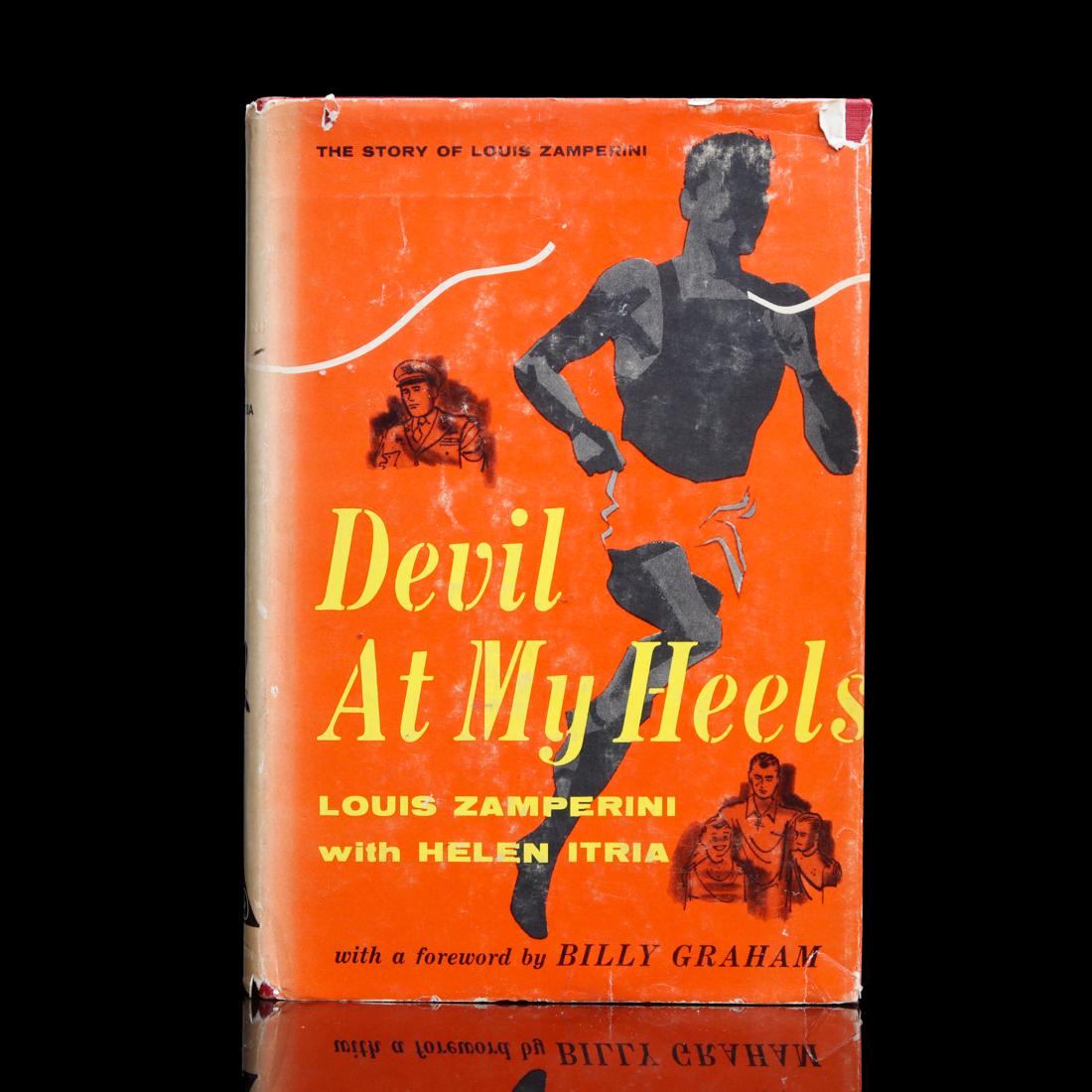 Louis Zamperini Signed Book "Devil at My Heels": Louis Zamperini Signed â€œDevil At My Heels” Book. Louis Zamperini (1917-2014) was a World War II veteran and Olympic distance runner. Zamperini competed in the 1936 Berlin Olympics and was 