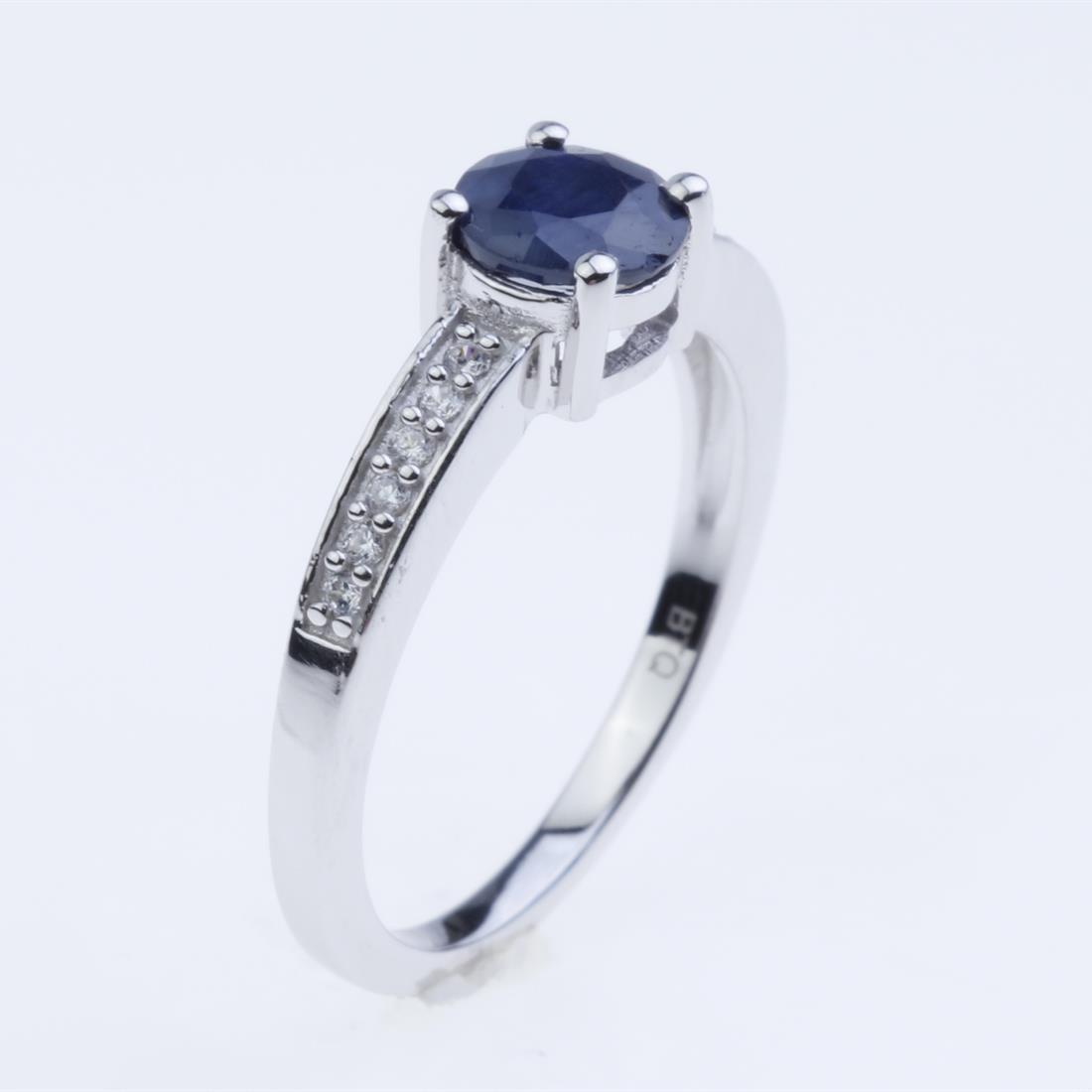 Size 9 Sapphire & White Zircon Silver Ring: Size 9 Sapphire & White Zircon Silver Ring • Metal: Sterling Silver • Stone: 6Mm Round Sapphire, Zircon • Width : 6.0 Mm • Appx Weight: 2.48 Grams • Finish: Rhodium